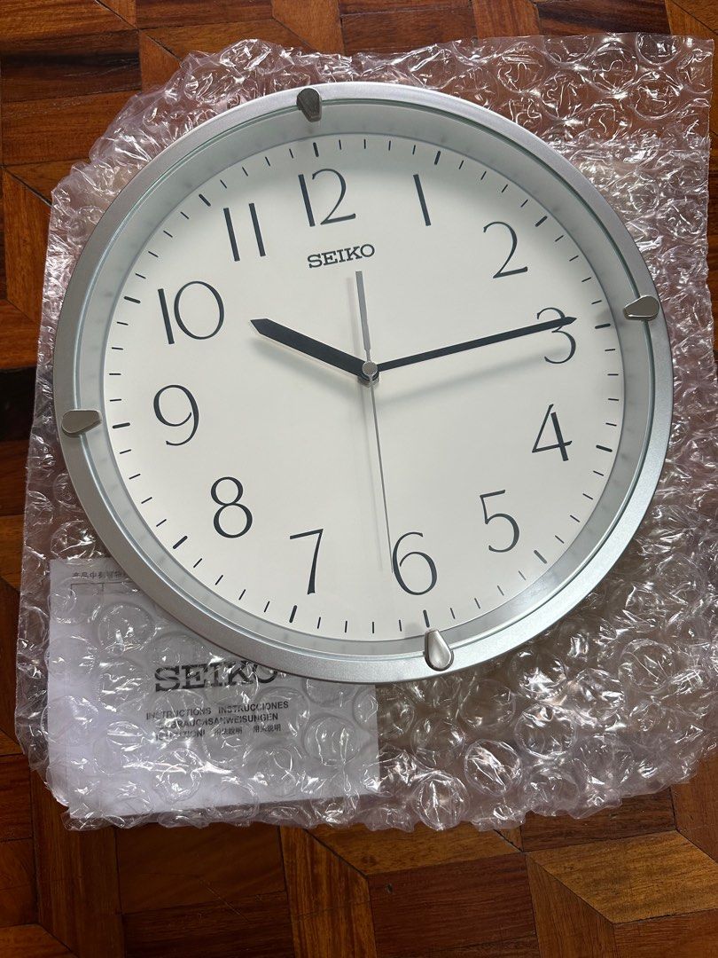 Seiko Wall Clock QHA007S (Category: Wall Decor) located in Manila. Submitted by seikowatchfactory (Listing ID 1327659471, Image 2). Description: Brand New in Box Authentic Seiko Clock 10/10 Model: QHA007S Price: 1495 pesos Specifications: Case Material: Silver Plastic Case Black Arabic Numerals Clock Type: Wall Clock Size: 30 x 4.2cm Battery: AA x 1 Weight: 0.65 kg 1 year Seiko official warranty White Dial Seller is Authorized Dealer of Seiko Jap
