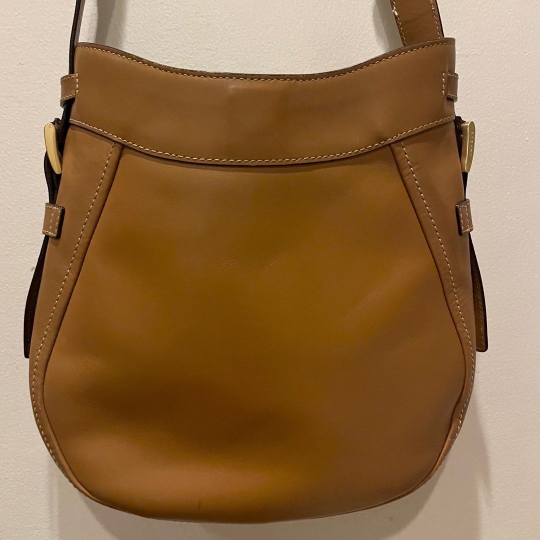 Brown Faux Leather Bag (Category: Cross-body Bags) located in Makati City. Submitted by elle.mango (Listing ID 1327731299, Image 2). Description: !! READ FIRST !! Selling my Sazaby bag, bought this in Tokyo, Japan. This is one of my faves but I need to let this bag go. - The bag has three compartments - Minor scratches/flaws (as seen on the last photo) RFS: will migrate soon Location: Makati City Sf must be shouldered by the buyer MOP: Gcash or b