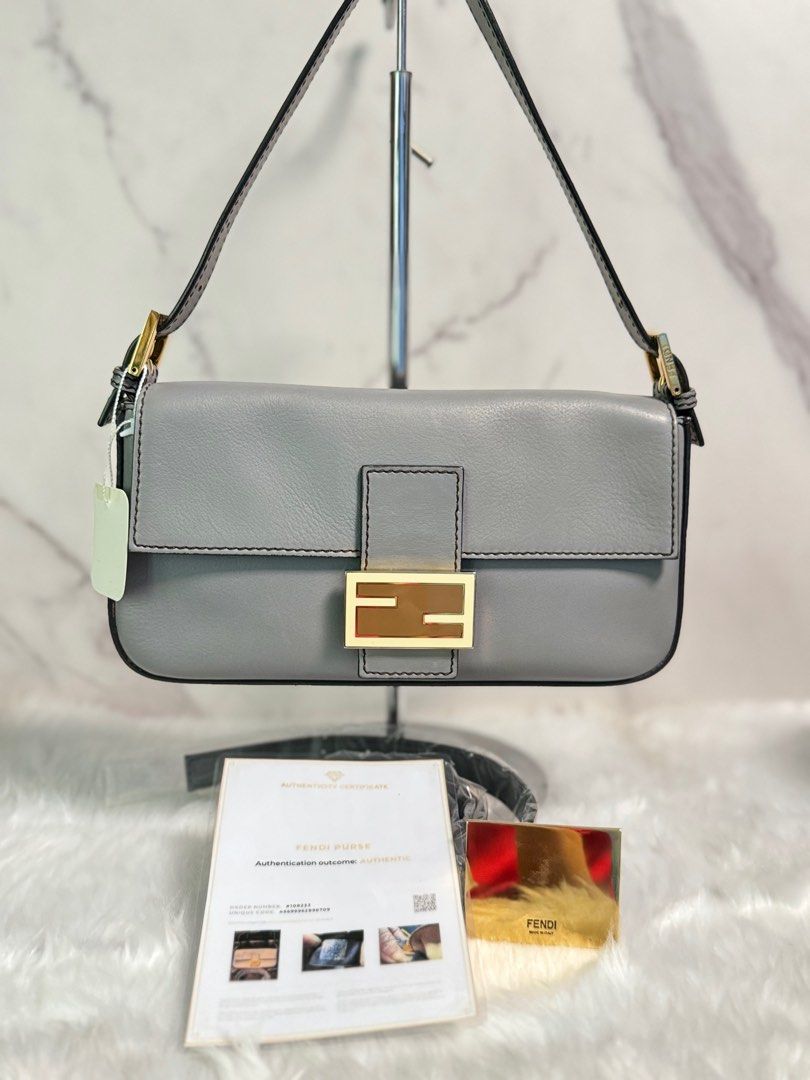 FENDI Vitello Flamingo Enamel Interchangeable Strap Baguette (Category: Luxury Bags & Wallets) located in Pasig City. Submitted by arpees.co (Listing ID 1327763355, Image 1). Description: Inclusions dust bag mirror unused srap Legit Grails.