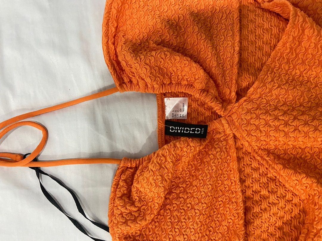 H&M ORANGE CUT-OUT THONG BODYSUIT (Category: Others Tops) located in Quezon City. Submitted by arem_ (Listing ID 1327815658, Image 3). Description: - Orange - Small on tag, can fit upto medium - bodysuit - No issues, used once Loc: Quezon City.