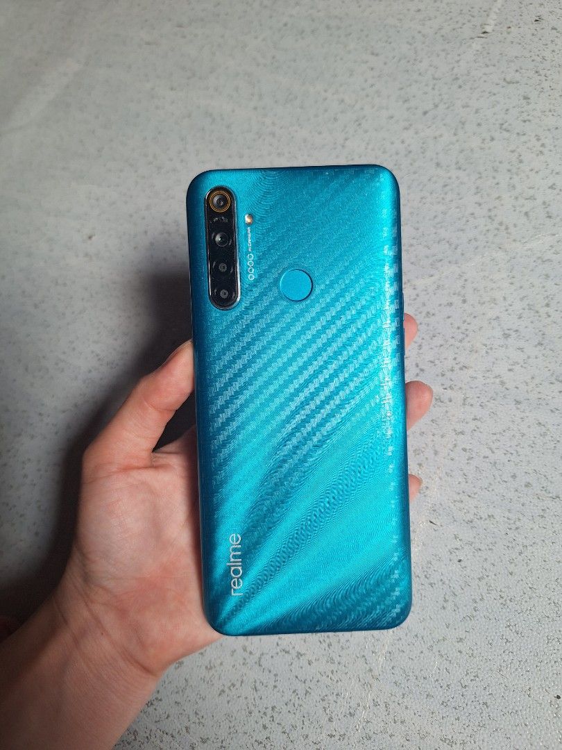 Realme 5i (Category: Realme) located in Caloocan City. Submitted by re.wearbyrecca (Listing ID 1327729886, Image 2). Description: Realme 5i see specs in the last picture with box with charger Issue: lag and battery bawal sa maarte negotiable buy at your own risk Rfs: spare phone only.