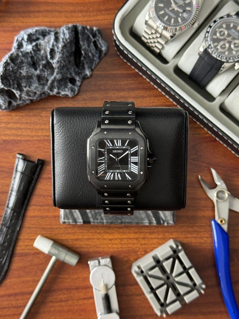 Seiko Black Out Santos XL Mod (Category: Luxury Watches) located in Quezon City. Submitted by mnl.chll (Listing ID 1327815348, Image 1). Description: Seiko Black Out Santos XL Mod Case: Durable stainless steel Weight: 160g Diameter: 38mm with a 12mm thickness Strap: customizable (Leather) Movement: Seiko NH35 Automatic Mechanical Mode of Payment: BANK/GCASH A ₱2,000 down payment (DP) is required to confirm your order, with the remaining balance t