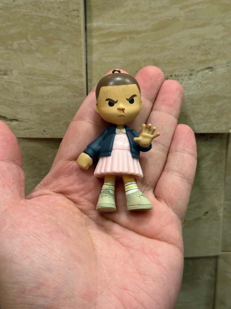 stranger things “eleven” keychain (Category: Western Merchandise) located in Quezon City. Submitted by chavzcity (Listing ID 1327875341, Image 1). Description: stranger things (keychain) eleven location: banawe, qc.