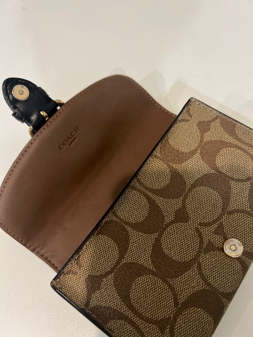 Coach Cleo Medium Wallet (Category: Luxury Bags & Wallets) located in Pasay City. Submitted by chii.b (Listing ID 1328021197, Image 3). Description: ✨Coach Cleo Medium Wallet✨ 〰️Original / money back guarantee 〰️Signature coated canvass and smooth leather 〰️Snap closure with outside open pocket Inclusions: Care card💌 Condition: 8.5/10 🤩 📍Pasay, Manila 📩DM us for inquiry❣️😉 .