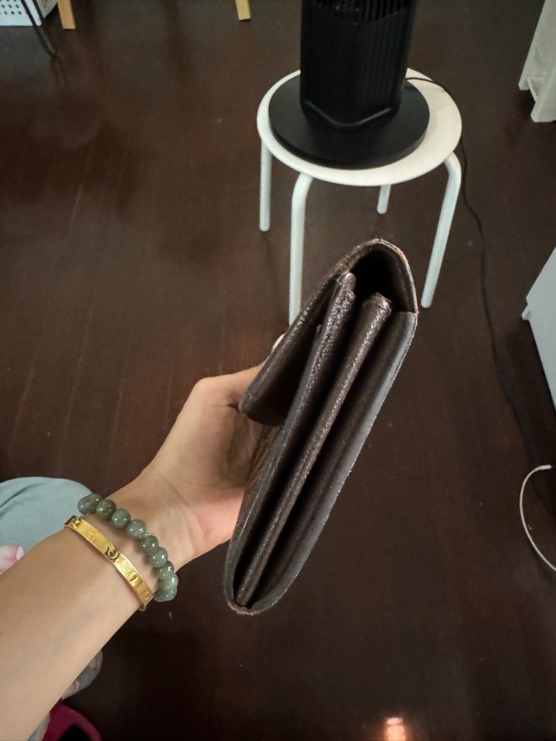 Louis Vuitton Damier Ebene Sarah Wallet (Category: Luxury Bags & Wallets) located in Makati City. Submitted by m_mna (Listing ID 1327892037, Image 3). Description: Louis Vuitton Sarah wallet Damier Ebene Condition:good B Card and coins pockets Size: 19 x 11 cm.