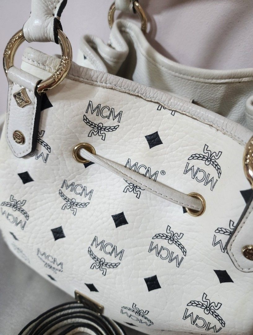 MCM Small Drawstring Bucket Bag (Category: Luxury Bags & Wallets) located in Valenzuela. Submitted by absolutelychick (Listing ID 1328018185, Image 2). Description: L 11.5" x W 5.75" x H 9.75" meron pong color transfer sa bandang ibaba sa front meron pong duminsa inner lining may maliit pong crack sa bottom part please check photo for reference jrs, lbc, j&t lalamove/grab ready.