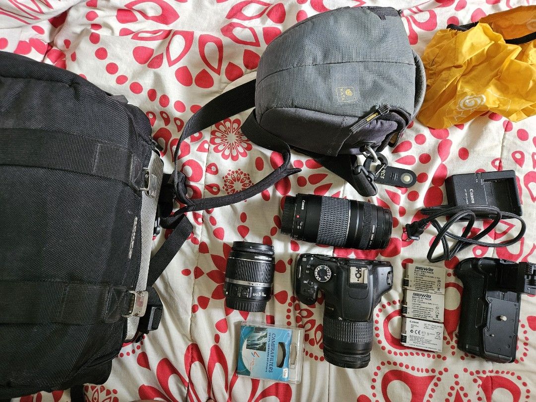 Canon Rebel T2i all in (Category: Cameras) located in Muntinlupa City. Submitted by a.mnl (Listing ID 1328075464, Image 3). Description: Issue: - signs of wear & tear Inclusions: - Canon DSLR Rebel T2i - Charger - 1 original canon battery pack -28-80mm lens - Kata Camera Bag - Canon Camera Bag with lens compartments - 64GB Strontium microSD card with adapter - 73-300mm lens - EFS 18-55mm lens (MF only).