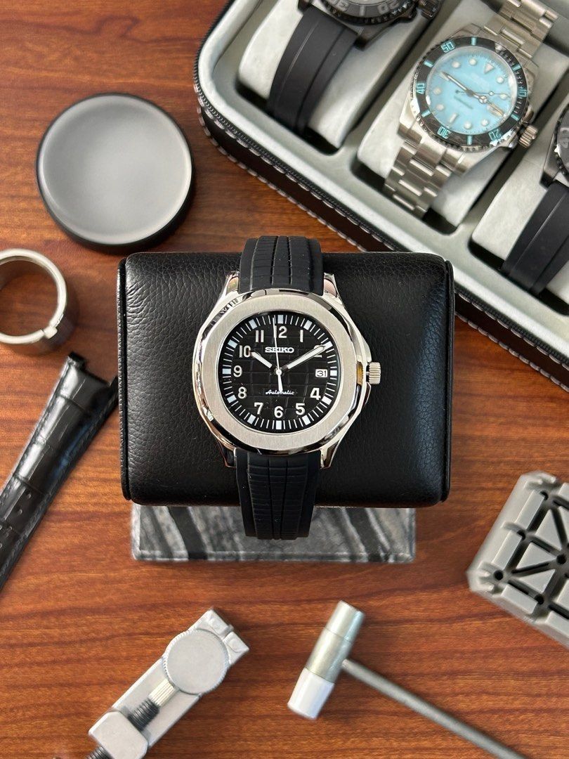 Seiko Aquanaut Black Dial Mod Watch (Category: Luxury Watches) located in Quezon City. Submitted by mnl.chll (Listing ID 1328250313, Image 1). Description: Seiko Aquanaut Black Dial Mod Watch Case: Durable stainless steel Weight: 160g for Diameter: 38mm Strap: Customizable (OYSTER/JUBILEE) Between Horns: 21mm, compatible with various straps Movement: Seiko NH35 Automatic Mechanical Mode of Payment: BANK/GCASH A ₱2,000 down payment (DP) is require
