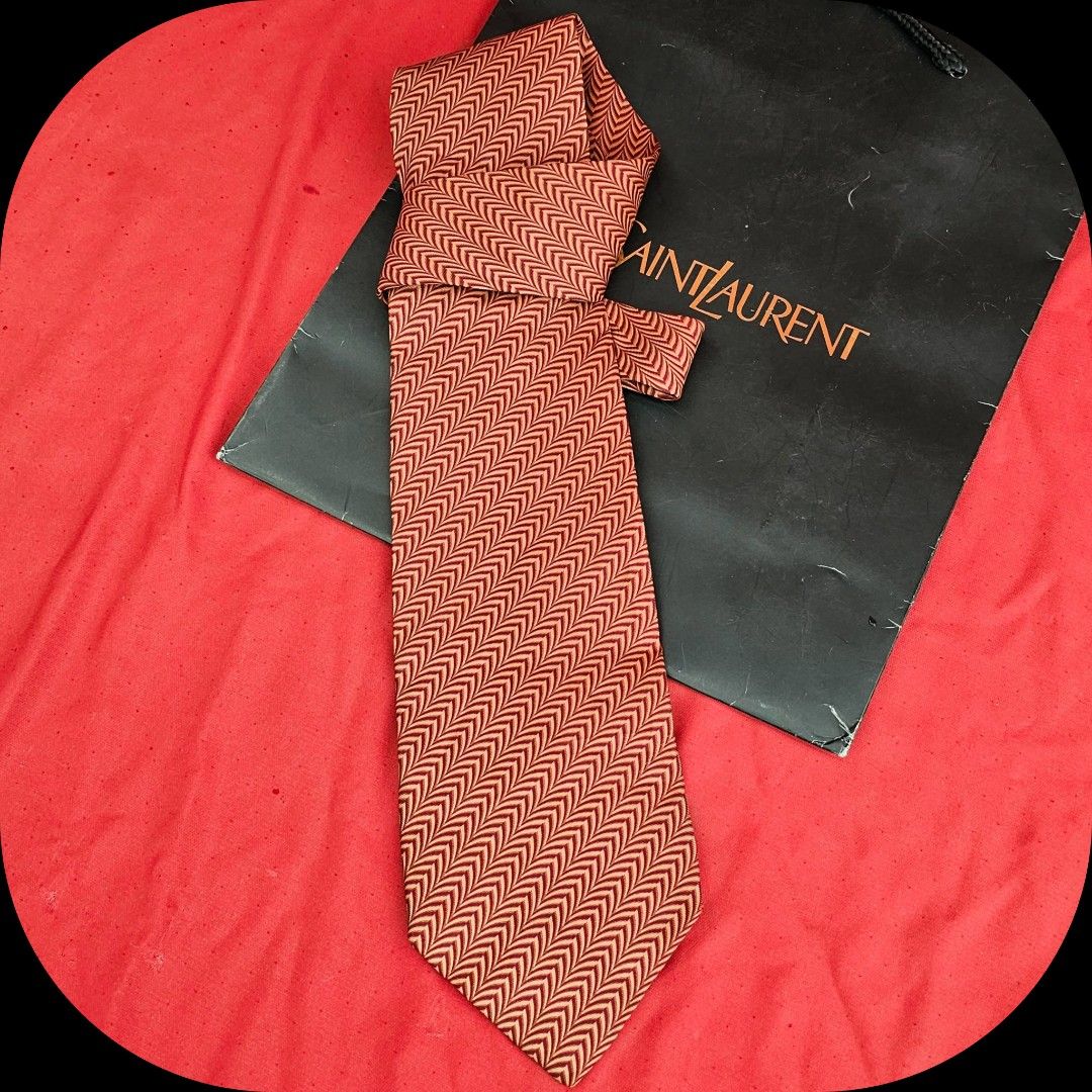🛑Ysl Brown Orange Silk Neck Tie (Category: Luxury Accessories) located in Baguio. Submitted by bagluxers_haven (Listing ID 1328199597, Image 3). Description: 🛑Authentic Ysl Brownish Orange Wave Pattern Silk Tie 🛑OVERALL CONDITION : 9.8/10 Like New & in Excellent & Flawless Condition but no more box. 🛑MOP : Bpi, Union Bank, Gcash. 🛑Do inquire if you need further assistance..