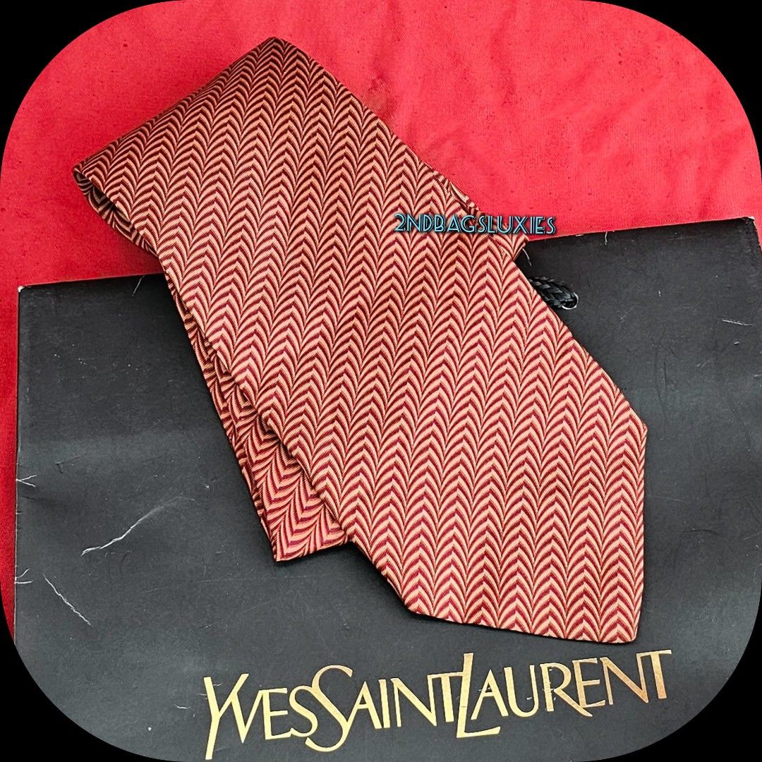 🛑Ysl Brown Orange Silk Neck Tie (Category: Luxury Accessories) located in Baguio. Submitted by bagluxers_haven (Listing ID 1328199597, Image 1). Description: 🛑Authentic Ysl Brownish Orange Wave Pattern Silk Tie 🛑OVERALL CONDITION : 9.8/10 Like New & in Excellent & Flawless Condition but no more box. 🛑MOP : Bpi, Union Bank, Gcash. 🛑Do inquire if you need further assistance..