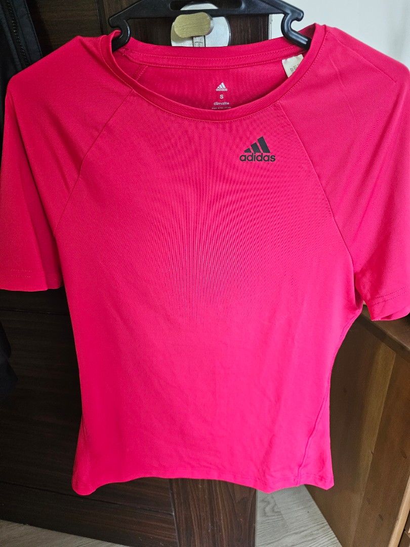 Adidas Climalite Shirt (Category: Blouses) located in Taguig. Submitted by riello (Listing ID 1323492610, Image 2). Description: Selling slightly used, very vibrant red, stretchy fabric adidas sport shirt. For gym, running etc. Guaranteed original, given as a gift, kept in closet, not worn much as I prefer cropped shirts or thinner fabric. Can fit medium to small frames as it's not very slim fit..
