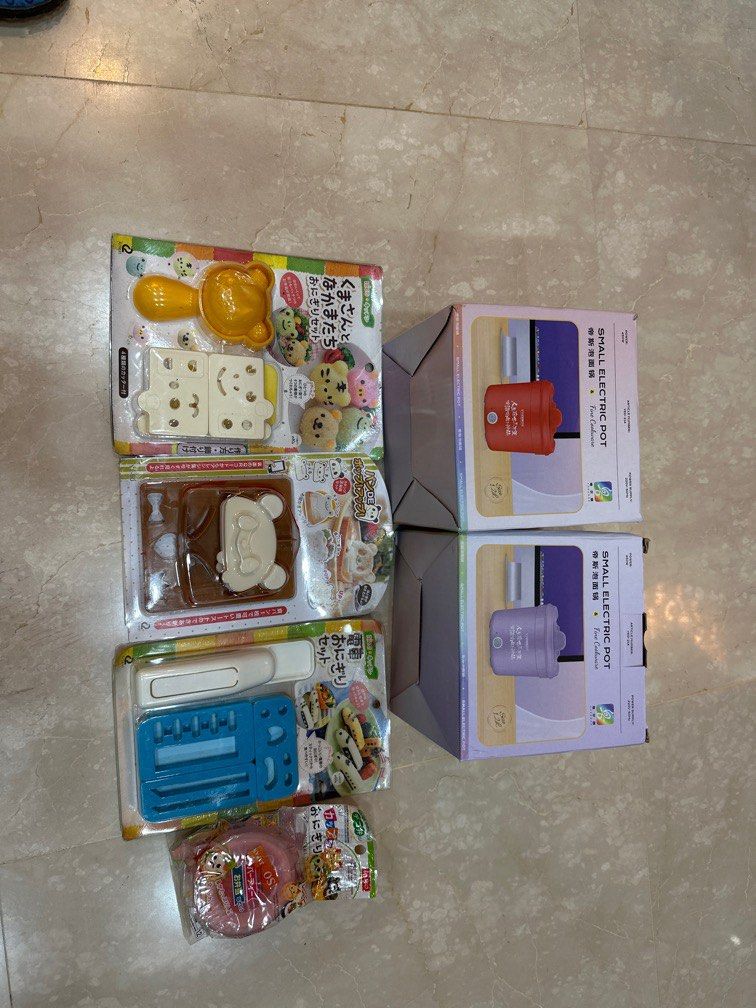 Assorted items (Category: Other Kitchenware & Tableware) located in Singapore. Submitted by newflower_6ea13f (Listing ID 1323567858, Image 1). Description: 2 small electric pots suitable for travel to cook food , sushi maker and bread maker. .