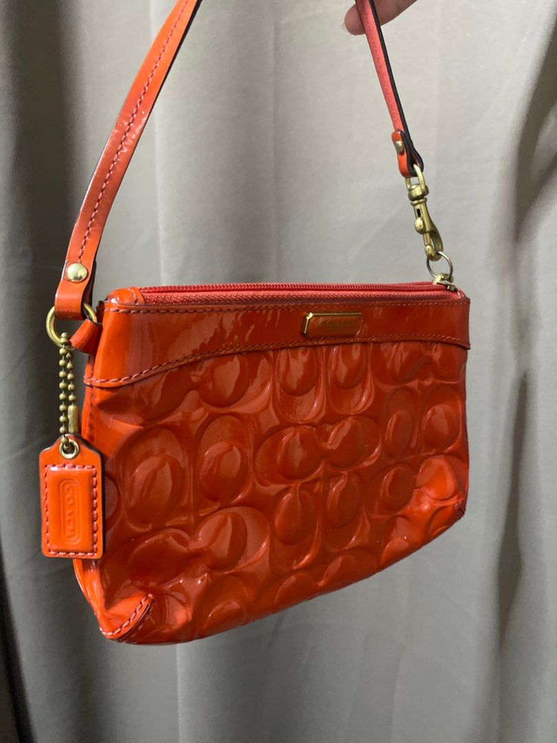 Coach Orange Pouch (Category: Purses & Pouches) located in San Juan City. Submitted by loveduseditems (Listing ID 1323512996, Image 1). Description: .