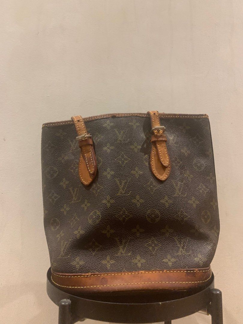 Louis Vuitton Petit Bucket Bag Project bag (Category: Luxury Bags & Wallets) located in Manila. Submitted by moneymann888 (Listing ID 1323558716, Image 3). Description: Sf Buyer shoulder Project Bag fix price Louis Vuitton Petit Bucket Bag Monogram Monogram Coded Vintage Honest Issue Honey Patina Ink Residue inside but clean cracks in lip lining and handle Bawal sa maselan.