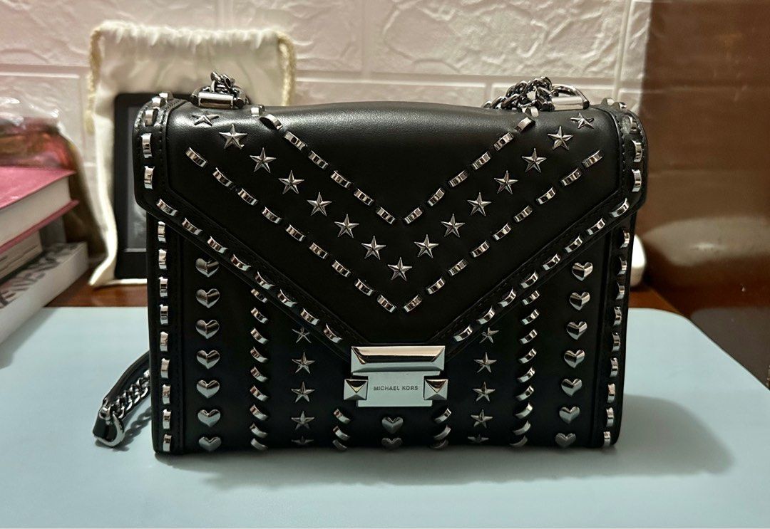 Michael Kors Chain Sling Bag (Category: Luxury Bags & Wallets) located in Pavia. Submitted by bellemaa (Listing ID 1323506796, Image 1). Description: Original Michael Kors Whitney Large Studded Leather Convertible Shoulder Bag • 100% leather • Gunmetal tone • 9.25”W x 7”H x 3”D • Adjustable strap: 12”-21” • Exterior Details: Back Snap Pocket • Interior Details: Back Zip Pocket, Center Zip Compartment, Front Slip Pocket • Lining: 100% Polyester • 