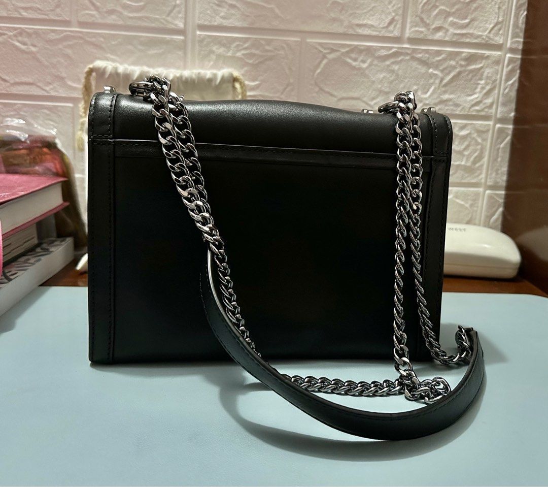 Michael Kors Chain Sling Bag (Category: Luxury Bags & Wallets) located in Pavia. Submitted by bellemaa (Listing ID 1323506796, Image 2). Description: Original Michael Kors Whitney Large Studded Leather Convertible Shoulder Bag • 100% leather • Gunmetal tone • 9.25”W x 7”H x 3”D • Adjustable strap: 12”-21” • Exterior Details: Back Snap Pocket • Interior Details: Back Zip Pocket, Center Zip Compartment, Front Slip Pocket • Lining: 100% Polyester • 