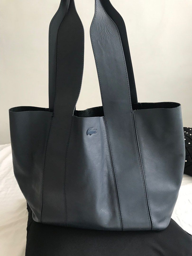 Lacoste Soft Leather Hand/Tote Bag (M) (Category: Luxury Bags & Wallets) located in Makati City. Submitted by laineycops (Listing ID 1328342978, Image 1). Description: w detachable pouch 2 compartments (incl of the pouch) min. wear as seen on photos 9.5-10in shoulder drop 10.75-11in length 17in wide 6in width at the bottom sold as is ***see about on profile rfs: decluttering.