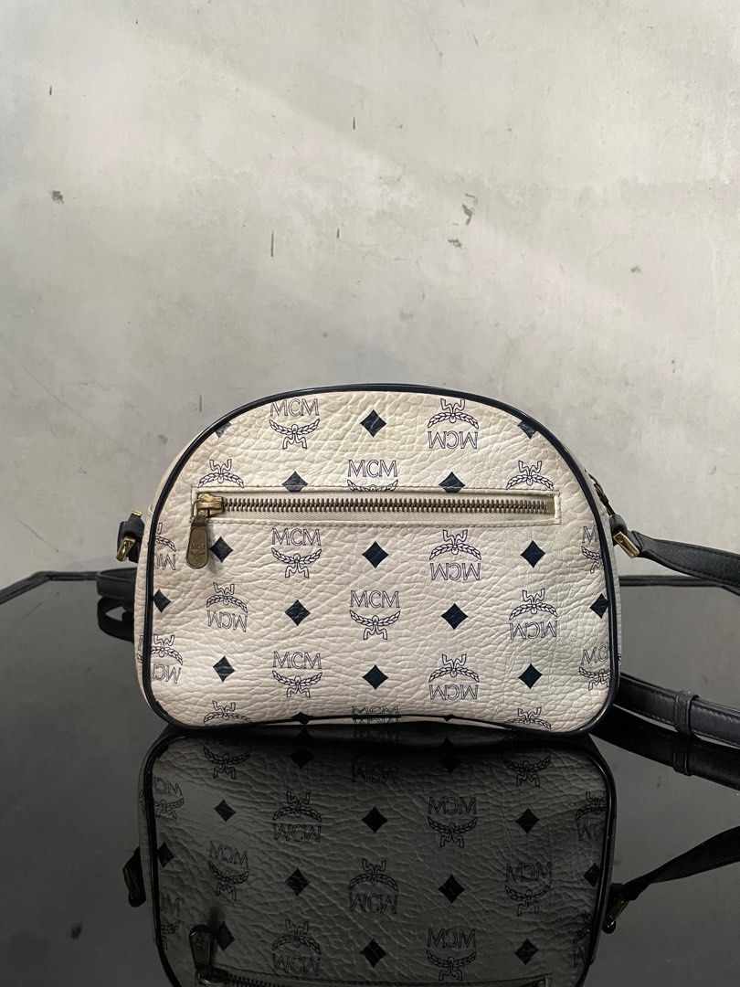 Mcm White Sling Bag (Category: Luxury Bags & Wallets) located in Manila. Submitted by prelovedbyykykyy (Listing ID 1328380102, Image 3). Description: WTS! Mcm White Sling Bag -Guaranteed Authentic -Germany -Dimensions: L 9.5in x H 6in x W 3in -Adjustable Strap Leather inside turns into suede due to expiration -Signs of use -Needs proper bag spa -Slight yellowing - 3,500 + Sf - Loc: Fairview Dm.