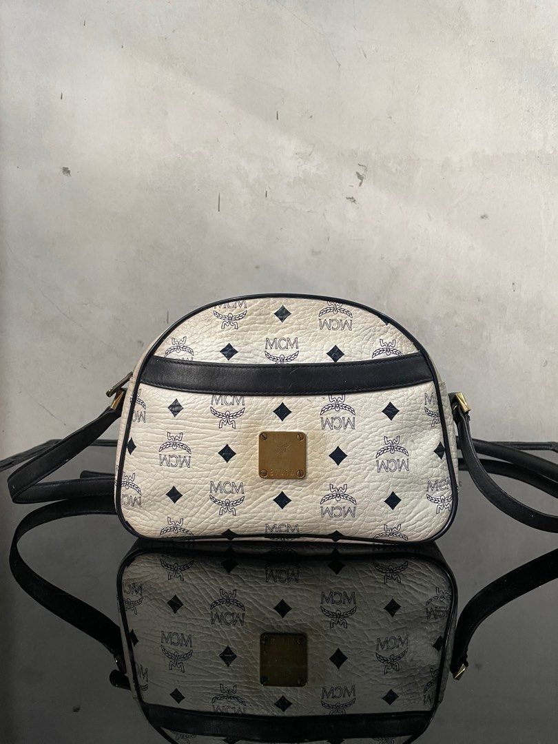 Mcm White Sling Bag (Category: Luxury Bags & Wallets) located in Manila. Submitted by prelovedbyykykyy (Listing ID 1328380102, Image 1). Description: WTS! Mcm White Sling Bag -Guaranteed Authentic -Germany -Dimensions: L 9.5in x H 6in x W 3in -Adjustable Strap Leather inside turns into suede due to expiration -Signs of use -Needs proper bag spa -Slight yellowing - 3,500 + Sf - Loc: Fairview Dm.