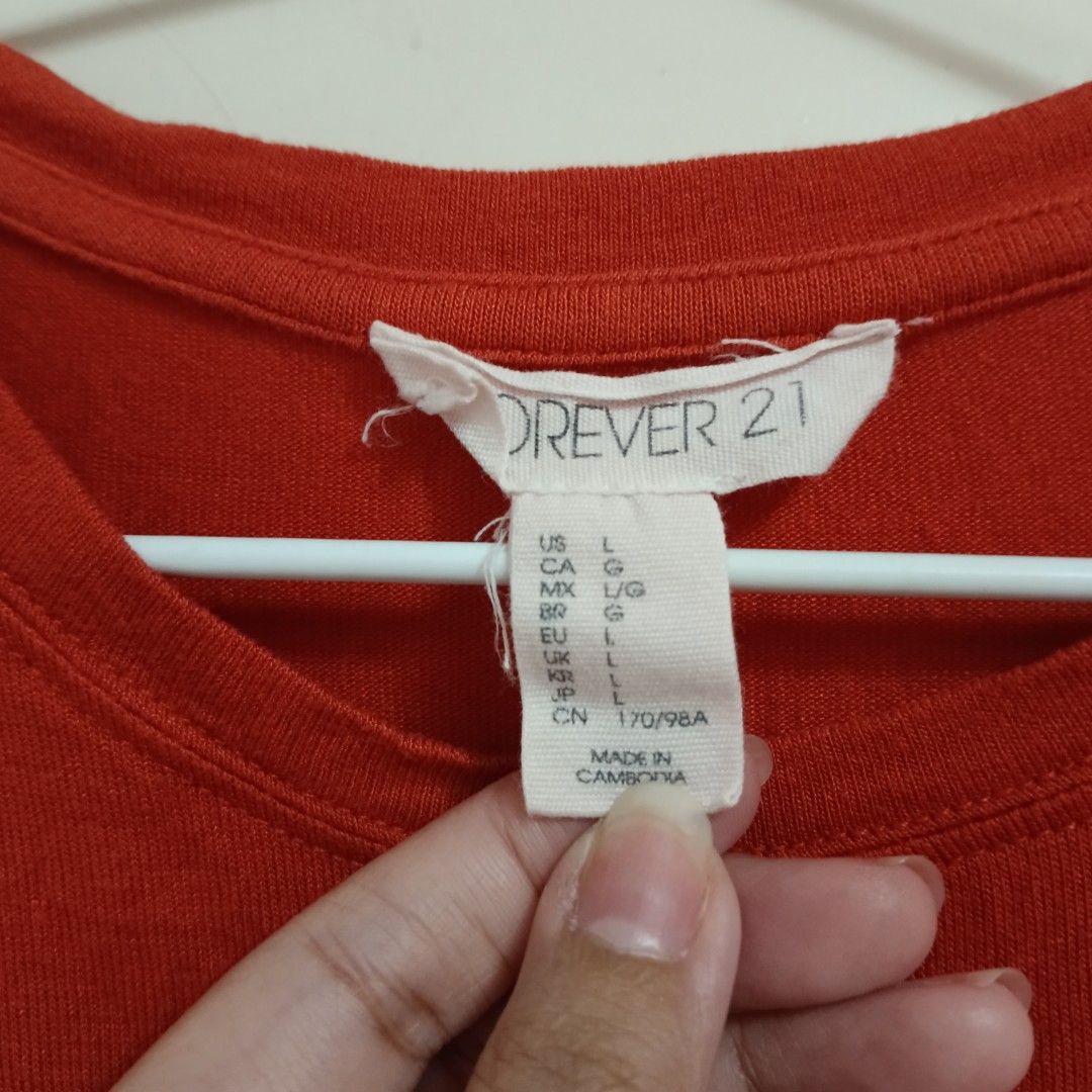 [SET] Forever 21 Black & Orange Baby Tee (Category: Shirts) located in Cainta. Submitted by closetnicoco (Listing ID 1328403884, Image 2). Description: selling for my sister! P150 for BOTH! please see photos for condition. himulmol in armpit areas, slightly loose threads, but both shirts are still usable. super thin and stretchy fabric. please manage expectations! CHECK OUT MY OTHER LISTINGS! 👗 Can give discount if you buy 2+ items 🛍 DM for any