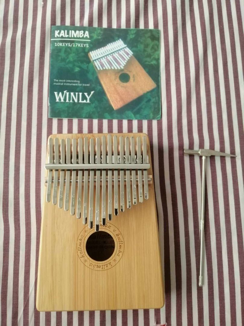 SALE!!! 17 Key Kalimba (Category: Musical Instruments) located in Butuan. Submitted by bbcatham (Listing ID 1323772587, Image 1). Description: used only for a week with tuning hammer and guide.
