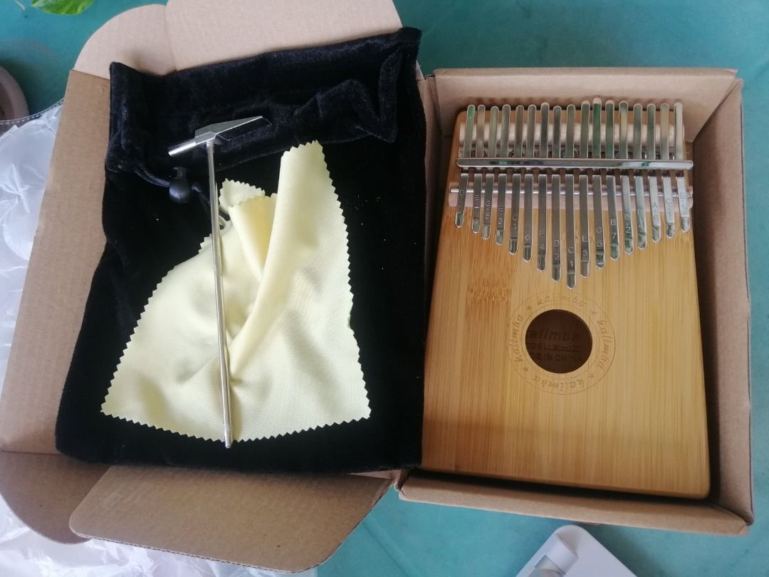 SALE!!! 17 Key Kalimba (Category: Musical Instruments) located in Butuan. Submitted by bbcatham (Listing ID 1323772587, Image 2). Description: used only for a week with tuning hammer and guide.