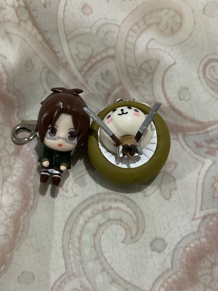 Attack on Titan Official Gachapon rare keychains (Category: Character Goods) located in Pasig City. Submitted by 21thunder (Listing ID 1323673865, Image 1). Description: - Rare - Purchased in Japan - Comes with green gachapon shell - Discontinued - Yung style ng isang charm parang hanging yung character .