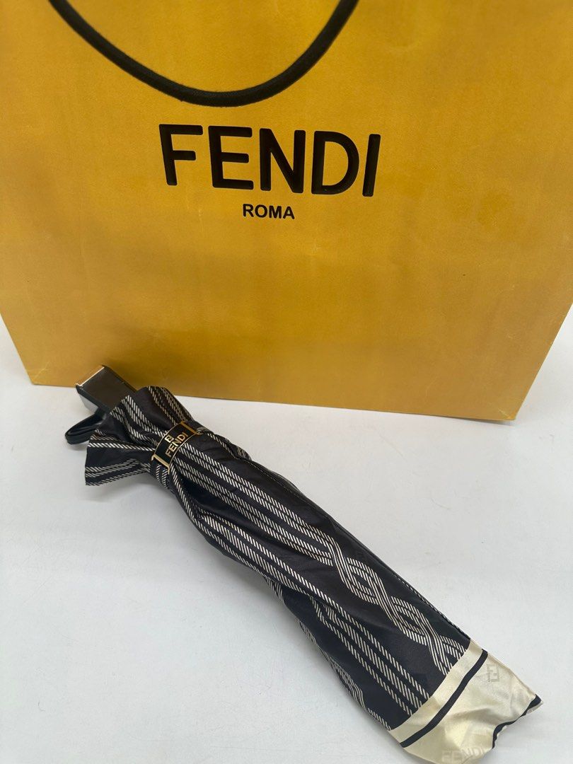 Fendi umbrella unused (Category: Umbrellas) located in Manila. Submitted by davidspreowned (Listing ID 1323768258, Image 1). Description: Fendi foldable umbrella unused stock only it comes with dustbag & paperbag minor fadings on the fendi logo but nevertheless no more issue.