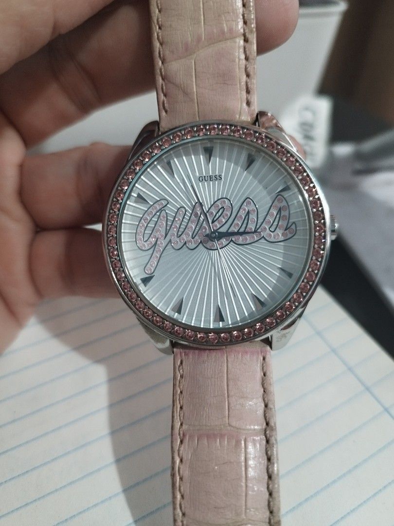Guess 20th Anniversary Women's Watch - Silver Script Dial & Pink Strap (Category: Luxury Watches) located in Quezon City. Submitted by redragtag (Listing ID 1323718324, Image 2). Description: GUESS 20th Anniversary Edition Women's Watch – Silver Script Dial & Pink Strap Description: Selling an authentic, limited-edition GUESS 20th Anniversary quartz watch. This eye-catching fashion piece features a silver sunray dial with a prominent crystal-stud