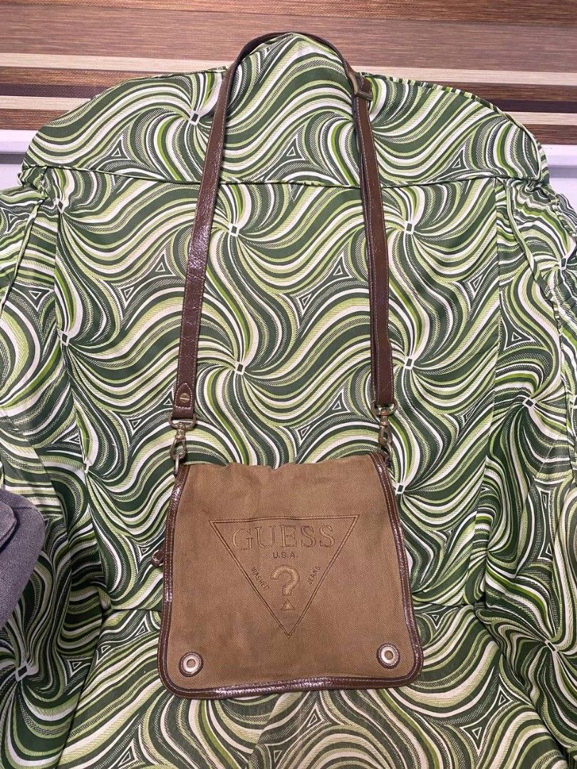 Original brown guess sling bag (Category: Cross-body Bags) located in Malolos. Submitted by sshoooo (Listing ID 1323689321, Image 2). Description: no issues just needing a wash.