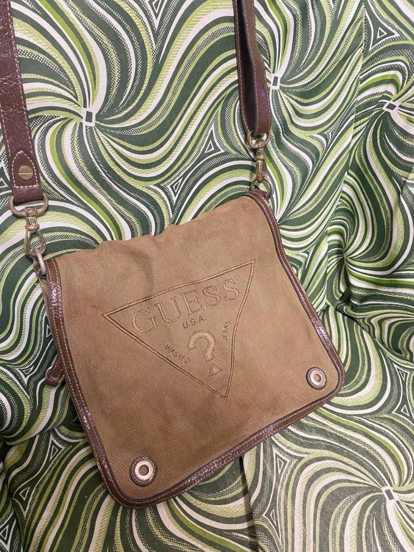 Original brown guess sling bag (Category: Cross-body Bags) located in Malolos. Submitted by sshoooo (Listing ID 1323689321, Image 3). Description: no issues just needing a wash.