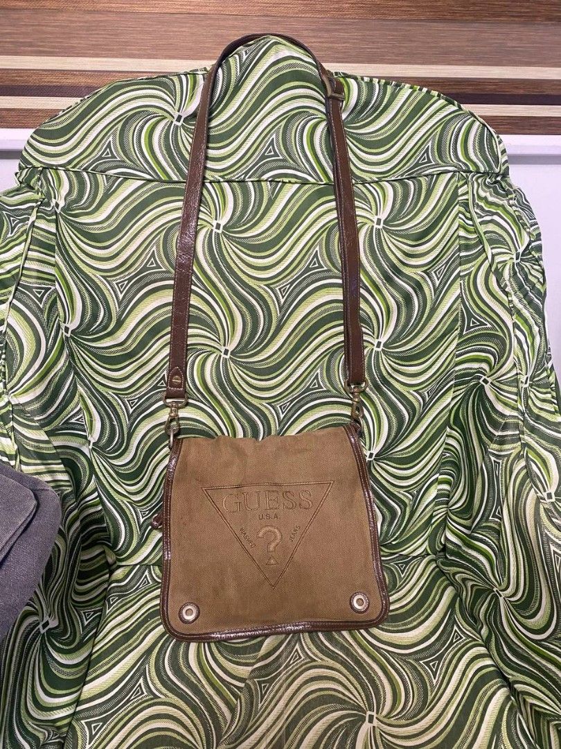 Original brown guess sling bag (Category: Cross-body Bags) located in Malolos. Submitted by sshoooo (Listing ID 1323689321, Image 1). Description: no issues just needing a wash.