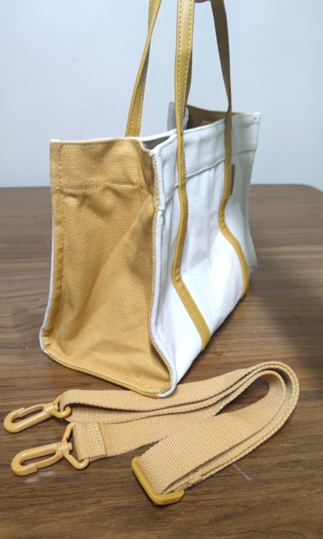 Agatha Paris two way bag (Mustard) (Category: Cross-body Bags) located in Pasig City. Submitted by chegutz_ (Listing ID 1323884511, Image 2). Description: Agatha Paris bag with tag bright mustard canvass/leather no stains excellent condition 💯 no issue RFS: decluttering Pasig City.