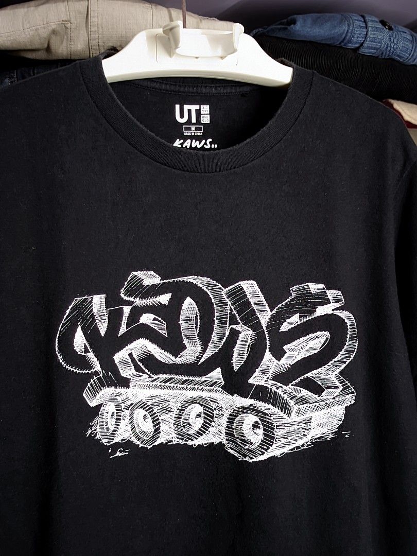 Kaws x Uniqlo (Category: Tshirts & Polo Shirts ) located in Baguio. Submitted by RacksToTheFuture (Listing ID 1323869106, Image 2). Description: medium used expect signs of usage.
