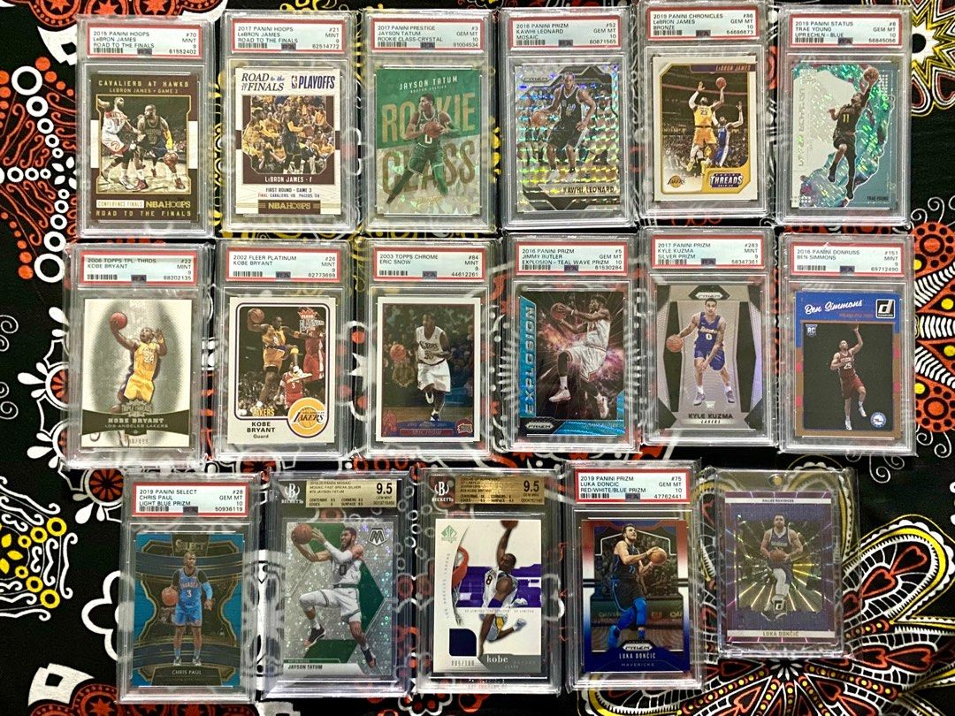 NBA CARDS GRADED SLABS (Category: Graded Singles) located in General Trias. Submitted by eddd14 (Listing ID 1323947409, Image 1). Description: -2019 PANINI SELECT CHRIS PAUL LIGHT BLUE PRIZM PSA 10 (POP 5) /299 - 3,500 -2015 PANINI HOOPS LEBRON JAMES ROAD TO THE FINALS PSA 9 (POP 1) /499 - 3,000 -2017 PANINI HOOPS LEBRON JAMES ROAD TO THE FINALS PSA 9 (POP 12) /2017 - 3,000 -2002 FLEER PLATINUM KOBE BRYANT PSA 9 - 2,700 -2019 PANINI STATUS TRAE Y