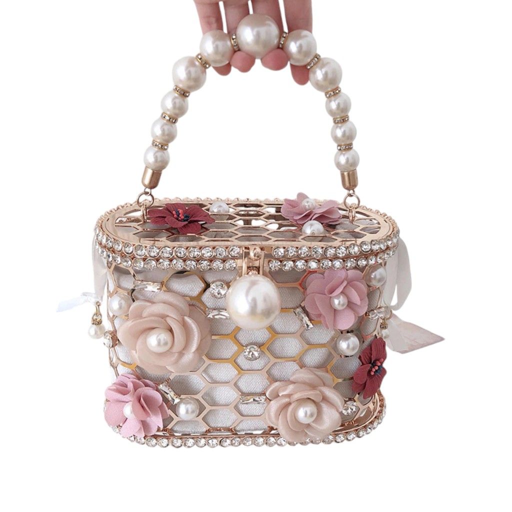 Luxury Stone Pearl Flower Handbag (Category: Luxury Bags & Wallets) located in Caloocan City. Submitted by shopfab. (Listing ID 1324018775, Image 1). Description: Material: Metallic Size: 18.8*9*12cm bought for 1500+ used once, good as new.