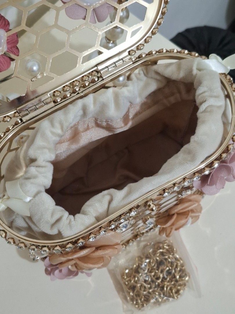 Luxury Stone Pearl Flower Handbag (Category: Luxury Bags & Wallets) located in Caloocan City. Submitted by shopfab. (Listing ID 1324018775, Image 3). Description: Material: Metallic Size: 18.8*9*12cm bought for 1500+ used once, good as new.