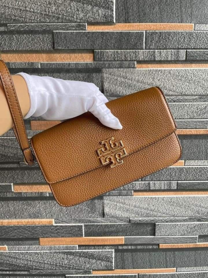 TORY BURCH Britten Chain Wallet with Wristlet (Category: Luxury Bags & Wallets) located in Manila. Submitted by stacey_lopez922 (Listing ID 1324092454, Image 3). Description: TORY BURCH Britten Chain Wallet with Wristlet (with dustbag and paperbag) - 8" L X 4.5" H X 1.5" W - Magnetic Closure Tory Burch Women's Britten Pebble Chain Wallet W. Wristlet with Gold Tone Hardware - Interior Detail: Custom TB Fabric Lining, 2 Slip Pockets, 1 Zip Pocket a