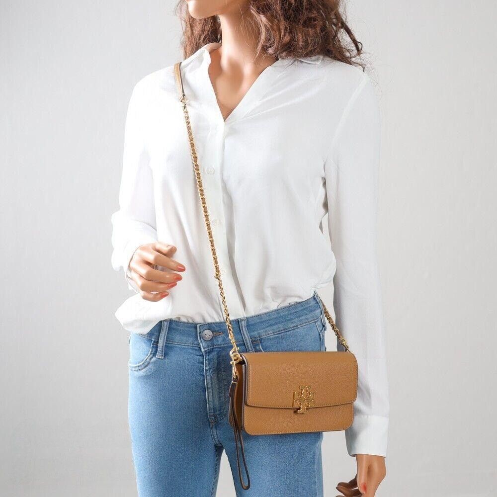 TORY BURCH Britten Chain Wallet with Wristlet (Category: Luxury Bags & Wallets) located in Manila. Submitted by stacey_lopez922 (Listing ID 1324092454, Image 2). Description: TORY BURCH Britten Chain Wallet with Wristlet (with dustbag and paperbag) - 8" L X 4.5" H X 1.5" W - Magnetic Closure Tory Burch Women's Britten Pebble Chain Wallet W. Wristlet with Gold Tone Hardware - Interior Detail: Custom TB Fabric Lining, 2 Slip Pockets, 1 Zip Pocket a