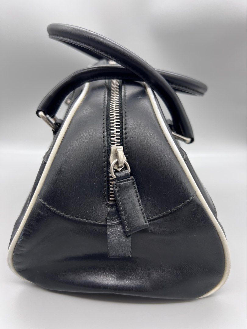 Authentic Prada Bowlers Bag (Category: Luxury Bags & Wallets) located in Cagayan de Oro. Submitted by riggstuffs (Listing ID 1311145886, Image 3). Description: ➡️ Guaranteed Authentic Prada Bowlers Bag Made in Italy With code Exterior area is good but has a slight signs of use Interior is clea Small in size No other inclusion Disclaimer : Riggstuffs is not associated or affiliated with the brand posted. All copyrights and trademarks belong solely