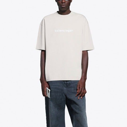 BALENCIAGA Logo Tee (Category: Tshirts & Polo Shirts) located in Singapore. Submitted by snowyjoy (Listing ID 1324363122, Image 2). Description: Non-nego, no trades No meetups Postage: $2 Wore once, in excellent condition Size: L, oversized fit.
