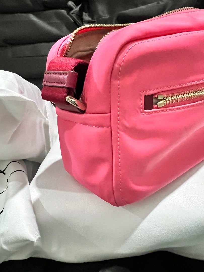 kate spade cute nylon camera bag (Category: Luxury Bags & Wallets) located in Bauang. Submitted by rjae07 (Listing ID 1324300962, Image 2). Description: cute kate spade camera bag pink/maroon guitar strap rank A no inclusion .