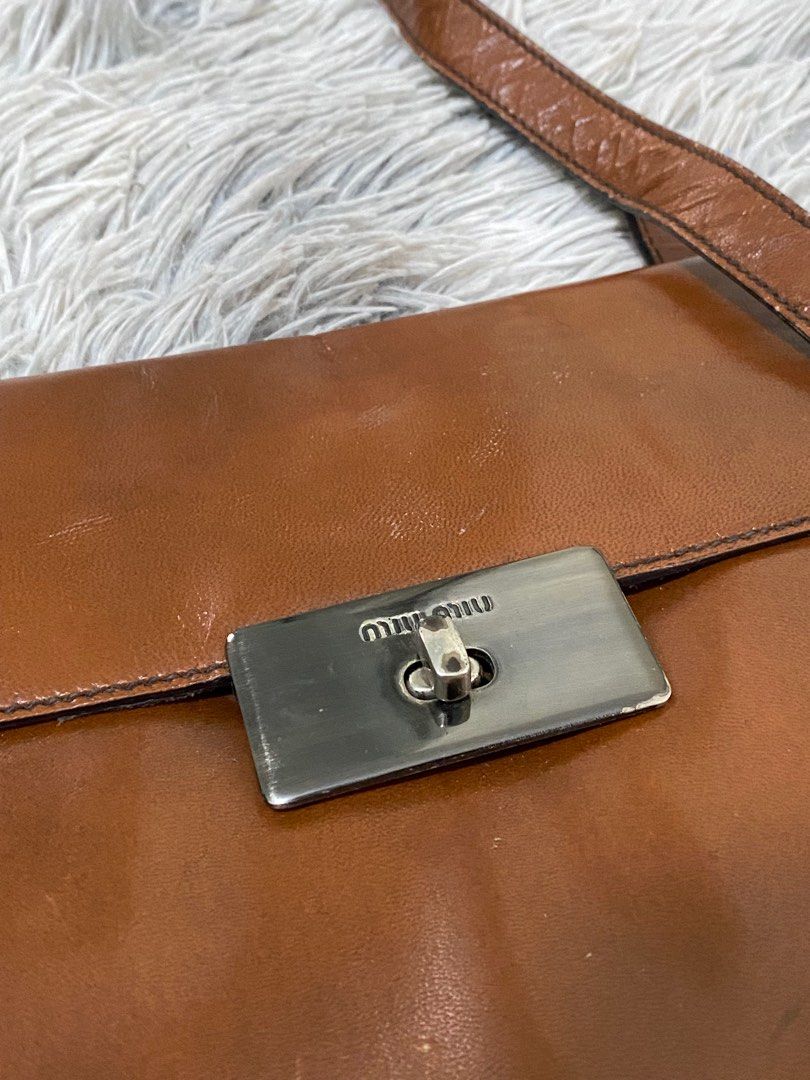 Miumiu (Category: Luxury Bags & Wallets) located in Makati City. Submitted by cheap.fleaaa (Listing ID 1324316921, Image 3). Description: Miumiu✨ Authentic💯 Shoulder Bag 500 + ship Issue: Cracks sa strap pero no flaws sa mismong bag Any courier Tarlac based📍.