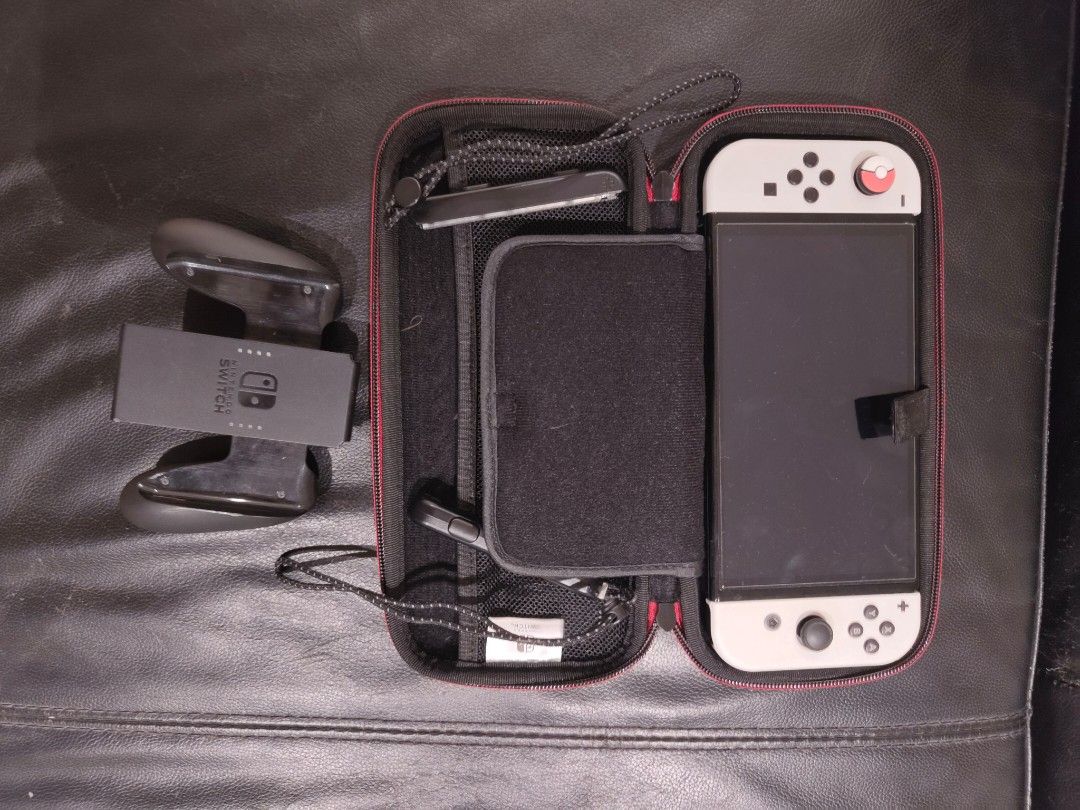 Nintendo switch OLED (Category: Nintendo) located in Singapore. Submitted by bingrru (Listing ID 1324345721, Image 2). Description: Comes with several games I have zeldas with a friend, top up 50$ for both..