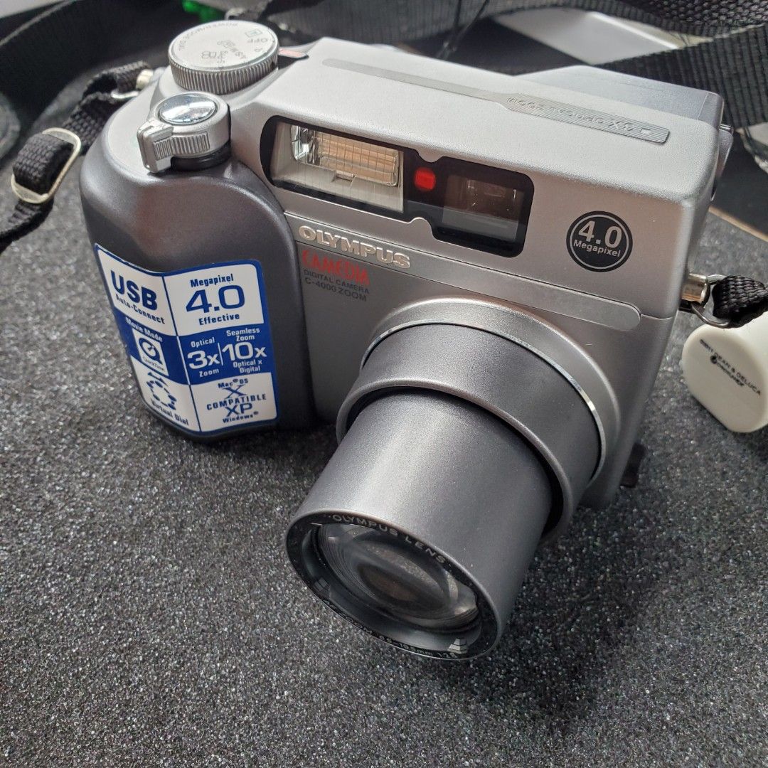 Olympus Camedia C-4000 Zoom (Category: Cameras) located in Pasay City. Submitted by corncube.collective (Listing ID 1324247877, Image 2). Description: OLYMPUS CAMEDIA C-4000 ZOOM Limited Edition!!! Hard to find ng Super mint condition neto. 10/10 Body Cosmetics 4.0 Megapixels 3x Optical Zoon 10x Seamless Zoom OptixalxDigital Inclusions -Unit - Camera strap -Camera Pouch #olympus #olympuscamedia #olympuscamediac4000zoom.