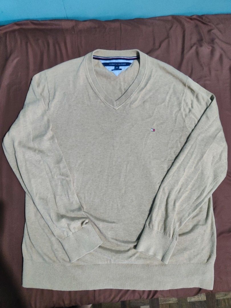 Tommy Hilfiger Knitted Pullover Longsleeves Sweater Vneck (Category: Coats, Jackets and Outerwear) located in Makati City. Submitted by gwnca_ (Listing ID 1324238490, Image 1). Description: Tommy Hilfiger Longsleeve Pullover Knitted (Coffee brown color) - Size: XXL - No flaws - Worn few times only - From US message for more info.