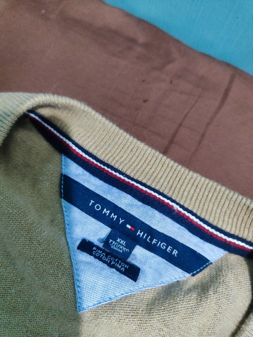 Tommy Hilfiger Knitted Pullover Longsleeves Sweater Vneck (Category: Coats, Jackets and Outerwear) located in Makati City. Submitted by gwnca_ (Listing ID 1324238490, Image 3). Description: Tommy Hilfiger Longsleeve Pullover Knitted (Coffee brown color) - Size: XXL - No flaws - Worn few times only - From US message for more info.
