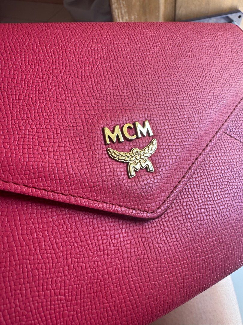 Rush!!! Authentic MCM Sling bag (pink) (Category: Luxury Bags & Wallets) located in Cavite. Submitted by leylamm (Listing ID 1324418549, Image 2). Description: Authentic. With minor discoloration at the back but still in very good condition. Spacious. Can fit your Pro Max phone and passports. Sling is removable, can also be used as clutch. .