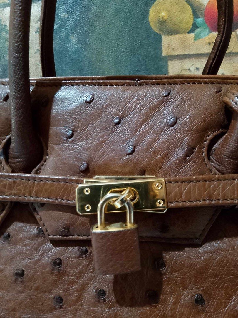 Christian Daniel Italy Birkin Ostrich (Category: Luxury Bags & Wallets) located in Muntinlupa City. Submitted by phbudgetluxuryfinds (Listing ID 1324510547, Image 3). Description: Authentic ostrich bag Gold hardware Rich brown color Preloved not brand new but good condition No damage or repair needed.