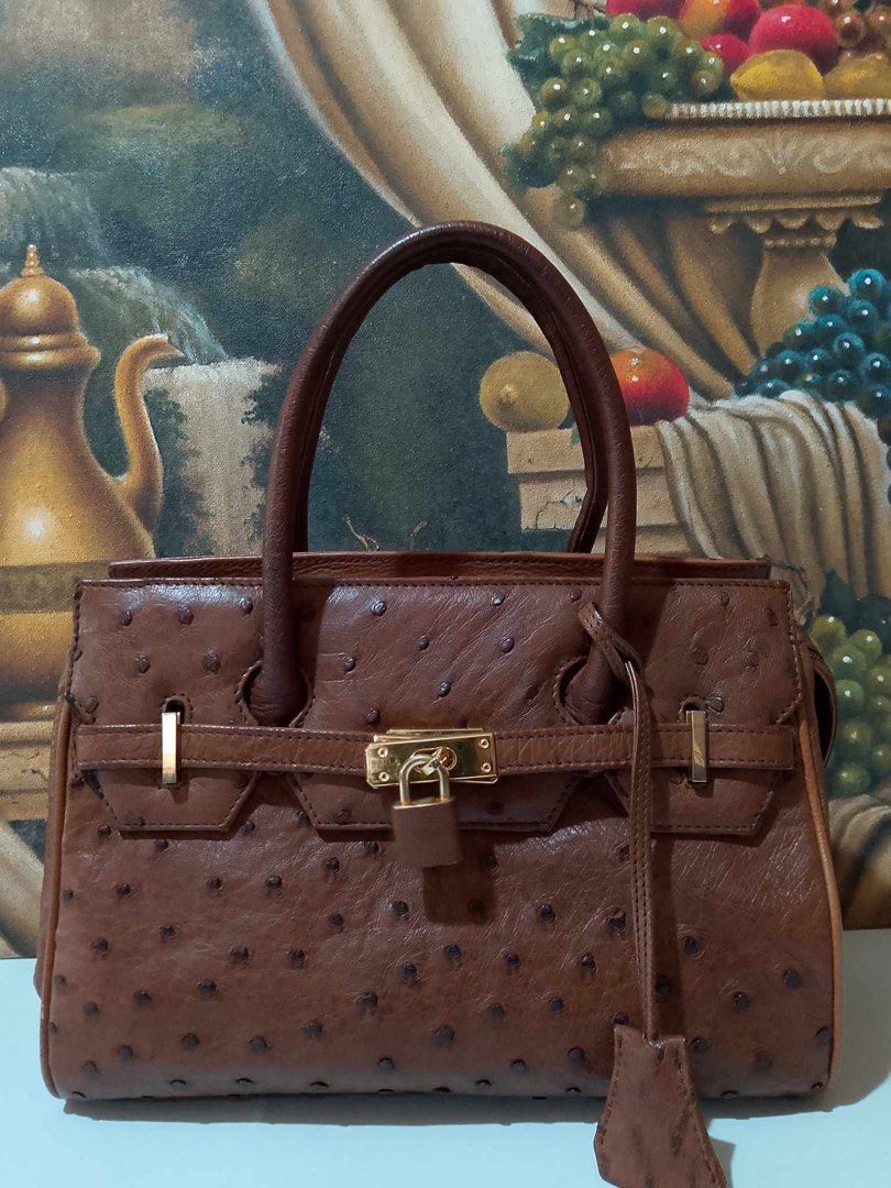 Christian Daniel Italy Birkin Ostrich (Category: Luxury Bags & Wallets) located in Muntinlupa City. Submitted by phbudgetluxuryfinds (Listing ID 1324510547, Image 1). Description: Authentic ostrich bag Gold hardware Rich brown color Preloved not brand new but good condition No damage or repair needed.